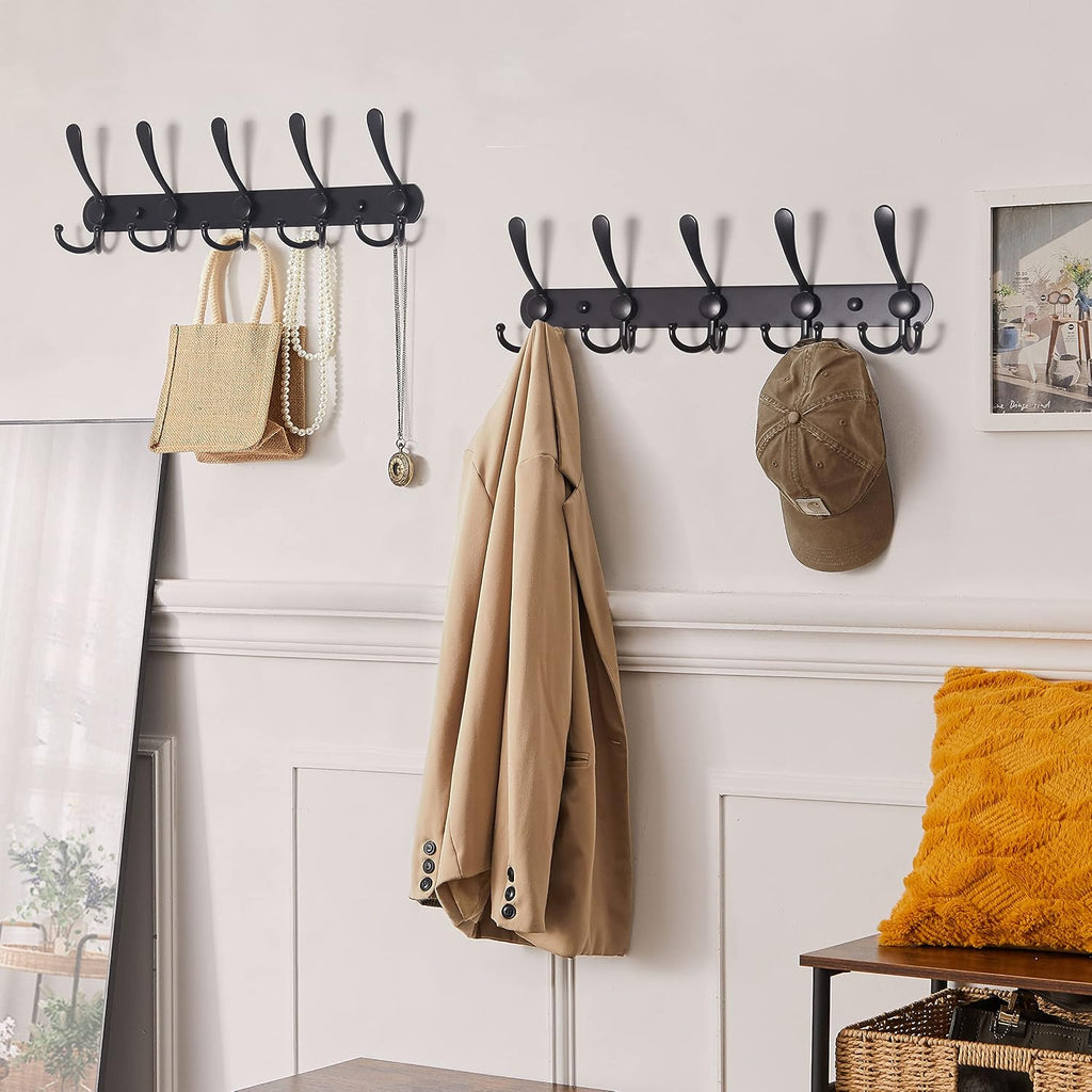 Wall-mounted coat rack—5 three-prong hooks.