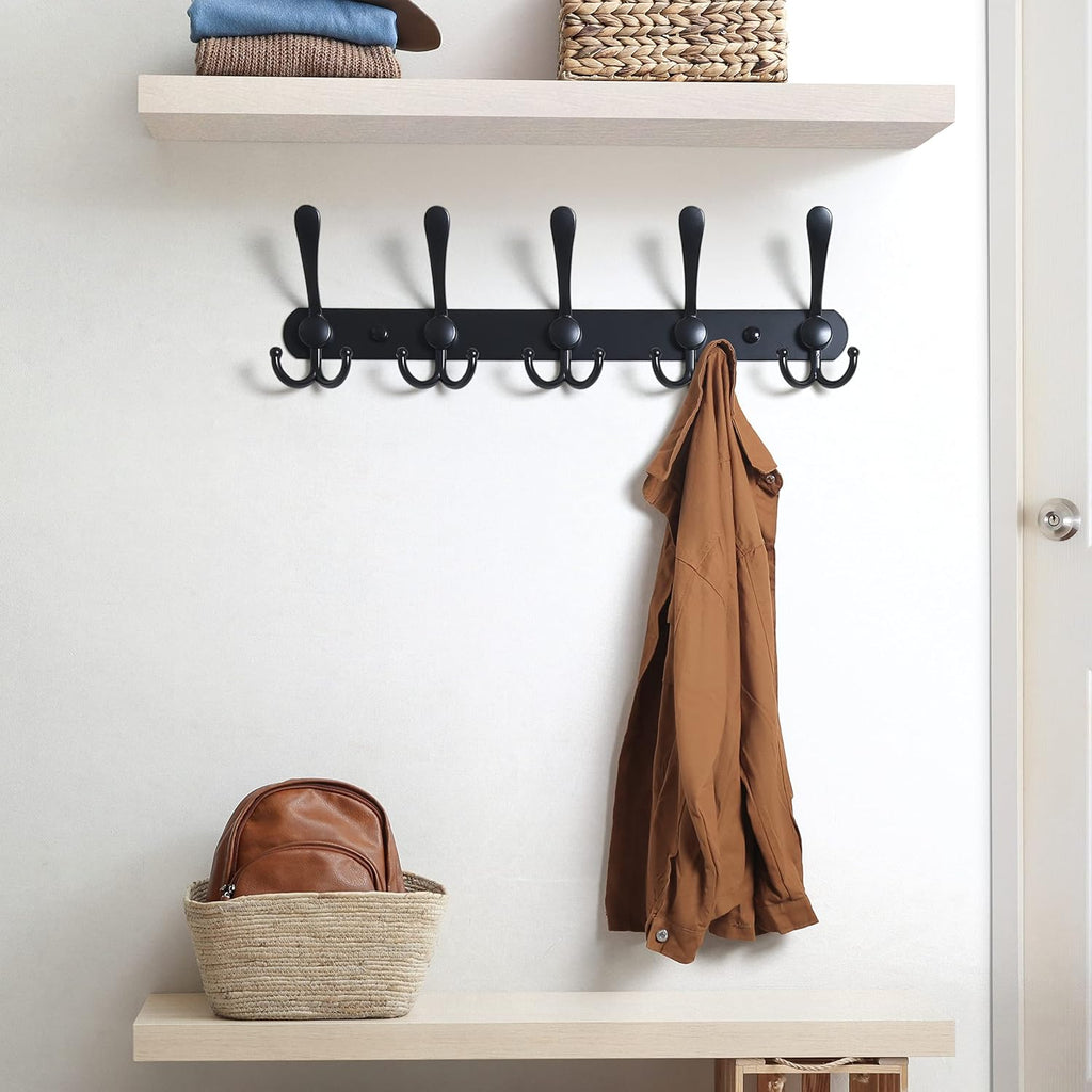 Wall-mounted coat rack—5 three-prong hooks.