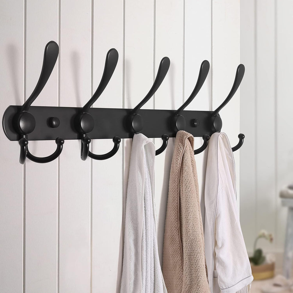 Wall-mounted coat rack—5 three-prong hooks.