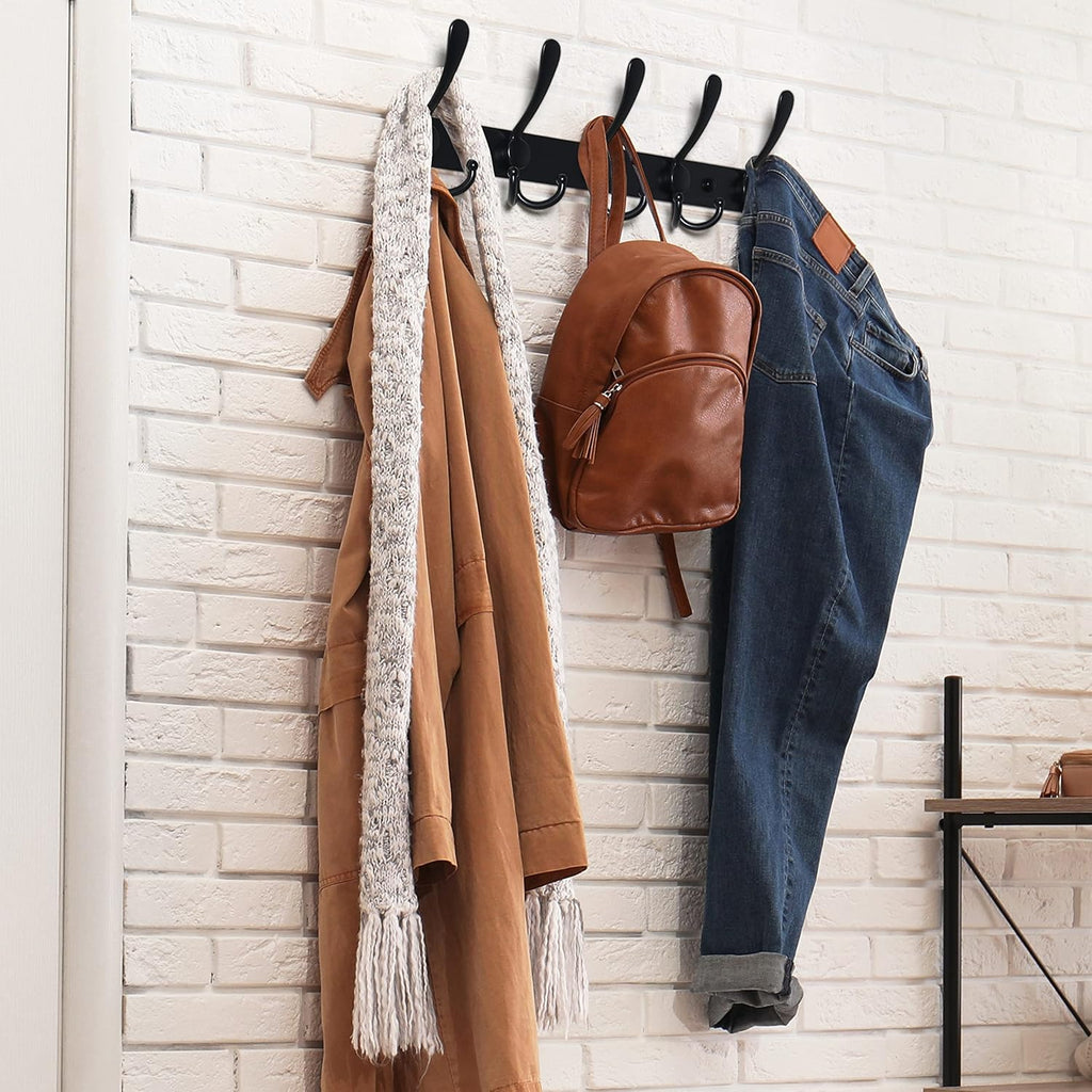 Wall-mounted coat rack—5 three-prong hooks.
