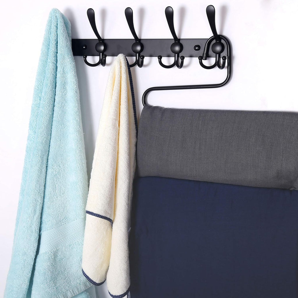 Wall-mounted coat rack—5 three-prong hooks.